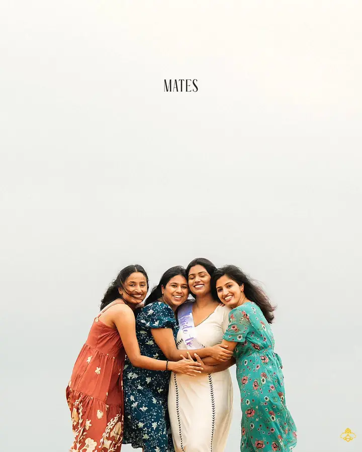 The bride and her closest friends in a group embrace