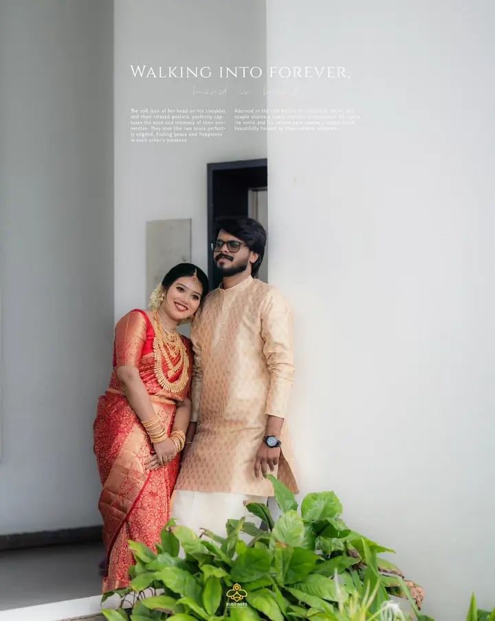 Bride in red and groom in gold brocade in a bright white room